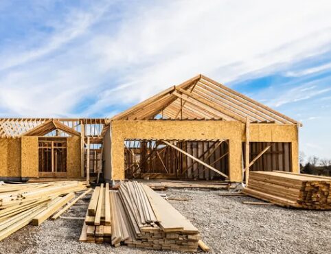 House under construction with wooden framework.